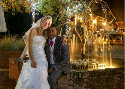 Bride and groom fountain pose at the barnyard, Kent